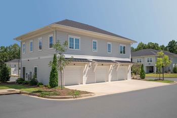 A two-story house with a garage on the first floor.